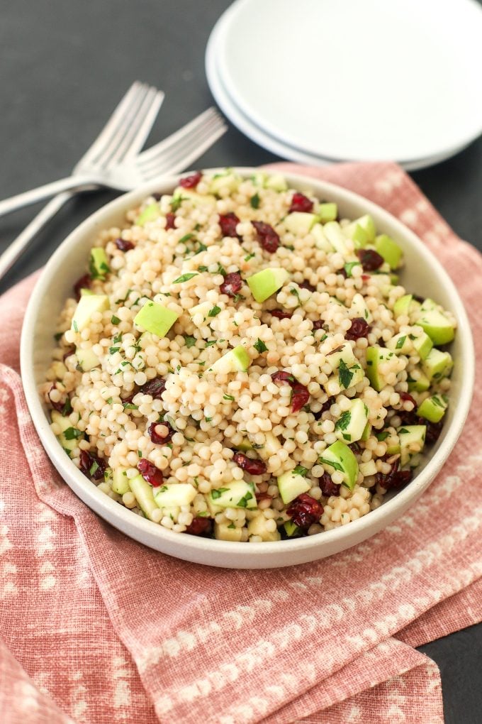 This Israeli Coucous with apples, cranberries and herbs is the perfect fresh side dish for fall!