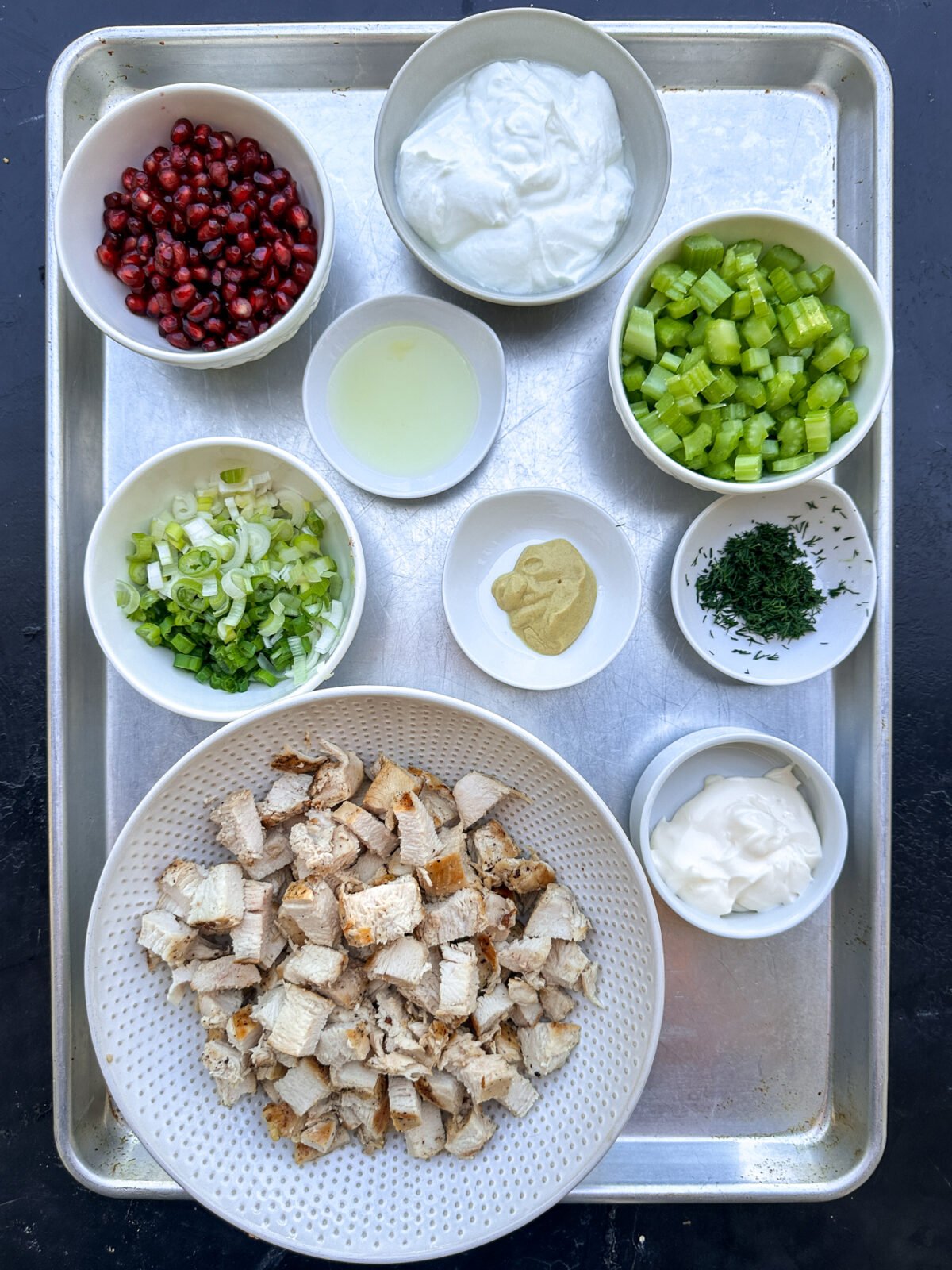 Fresh & flavorful Pomegranate Chicken Salad! Healthy, easy, and packed with juicy pomegranate seeds and a light yogurt dressing.