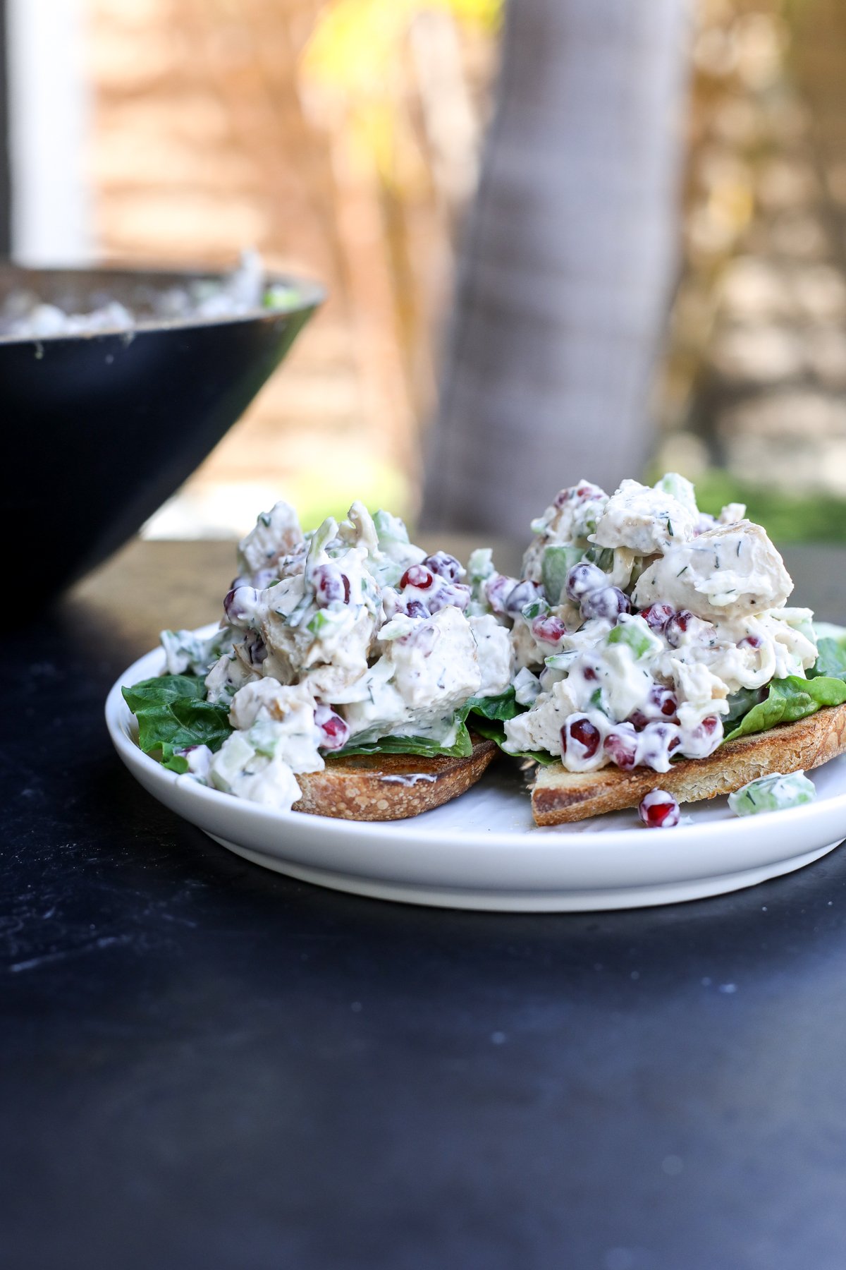 Fresh & flavorful Pomegranate Chicken Salad! Healthy, easy, and packed with juicy pomegranate seeds and a light yogurt dressing.