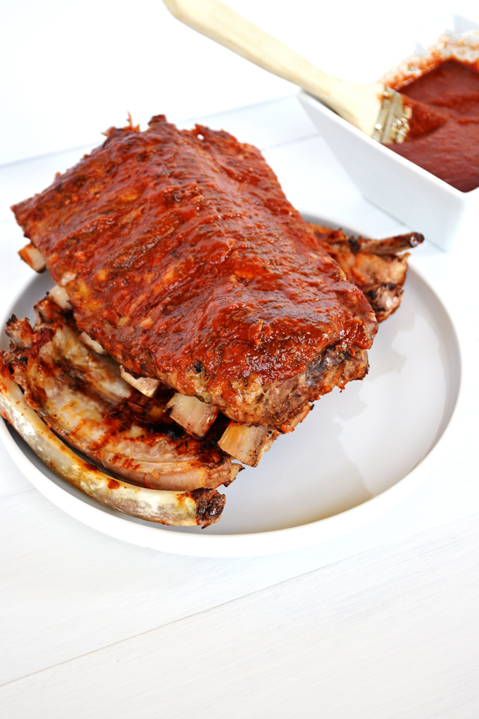 This BBQ Rib recipe is perfect for any time of year! The BBQ Sauce is sugar free, whole30 approved and paleo. The recipe also breaks down the perfect way to achieve fall off the bone ribs!