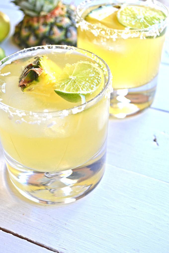 This Skinny Tequila Squeeze is the perfect way to have a drink without the guilt! Coconut water, pineapple juice and lime make a super refreshing mix!