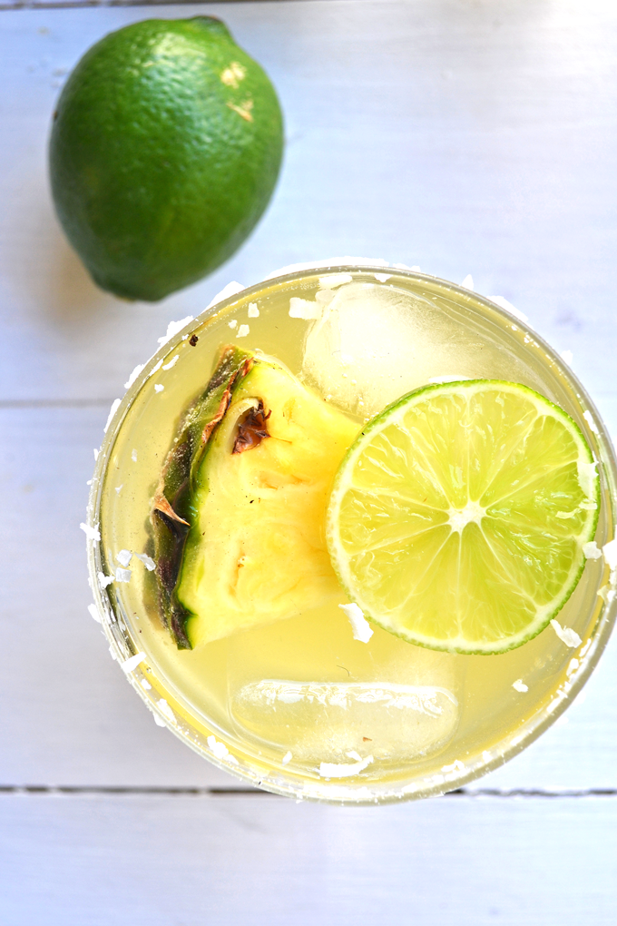 This Skinny Tequila Squeeze is the perfect way to have a drink without the guilt! Coconut water, pineapple juice and lime make a super refreshing mix!