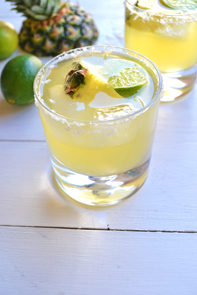 This Skinny Tequila Squeeze is the perfect way to have a drink without the guilt! Coconut water, pineapple juice and lime make a super refreshing mix!