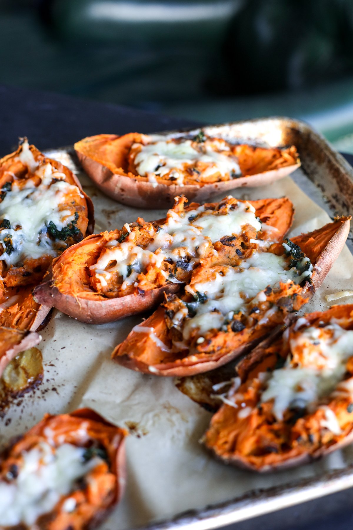 Delicious caramelized onion & kale twice-baked sweet potatoes, a healthy, savory side dish perfect for any meal!