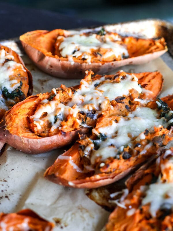 Delicious caramelized onion & kale twice-baked sweet potatoes, a healthy, savory side dish perfect for any meal!