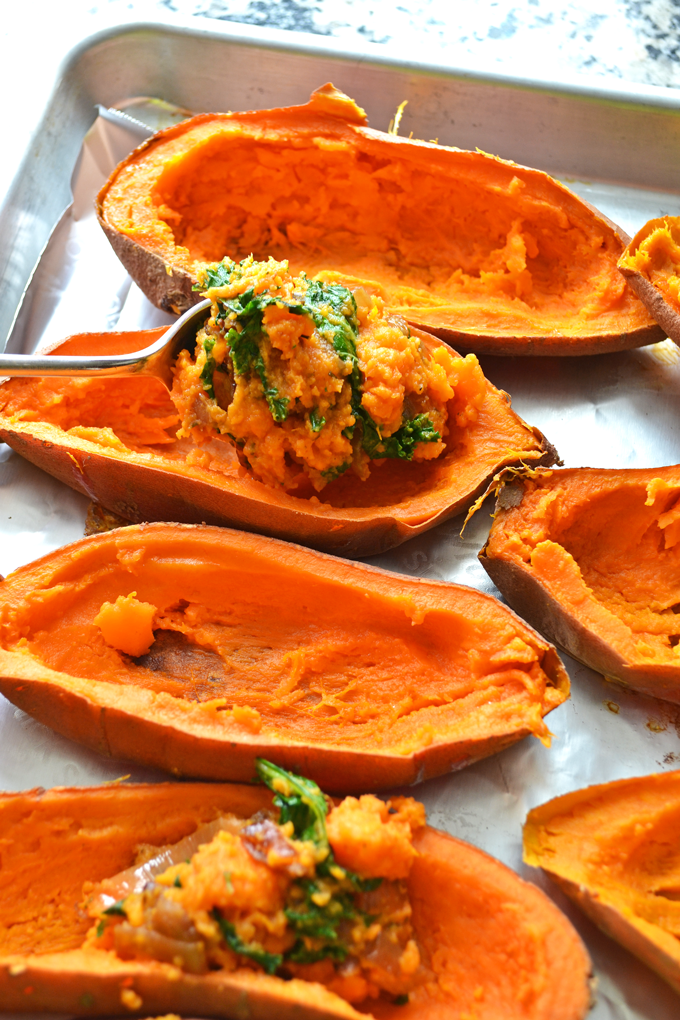 These Caramelized Onion & Kale Twice Baked Sweet Potatoes are packed with flavor and topped with gruyere cheese! 