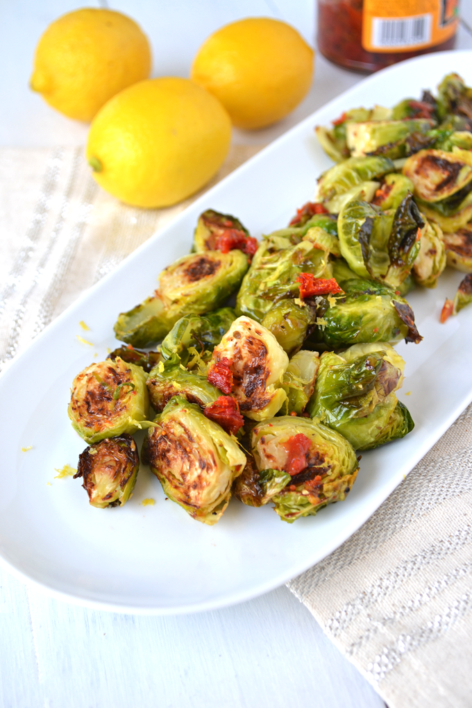 Lemon & Sun-Dried Tomato Brussels Sprouts! This recipe is full of flavor, paleo and Whole 30 approved! Such a fun way to mix up this side dish!