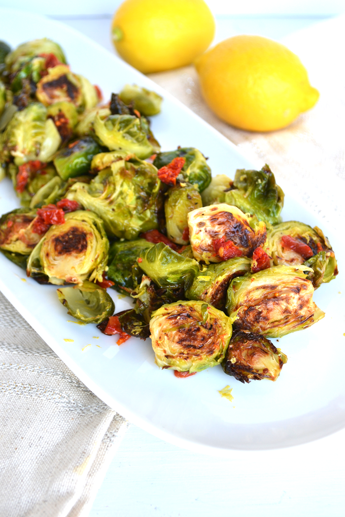 Lemon & Sun-Dried Tomato Brussels Sprouts! This recipe is full of flavor, paleo and Whole 30 approved! Such a fun way to mix up this side dish!