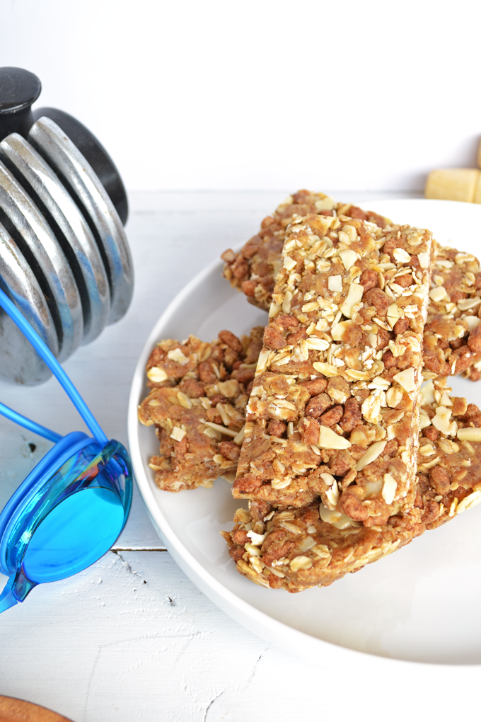 These Protein Packed Granola Bars are refined sugar free and gluten free! Almonds, nut butter & protein powder make these perfect for a pre-workout snack!