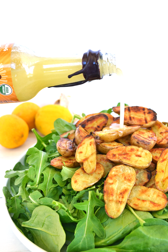 Tessamae's Lemon Garlic Vinaigrette uses all clean and Whole 30 approved ingredients and goes perfectly on this Grilled Potato Salad! It is a perfect light side dish for any spring or summer barbecue!