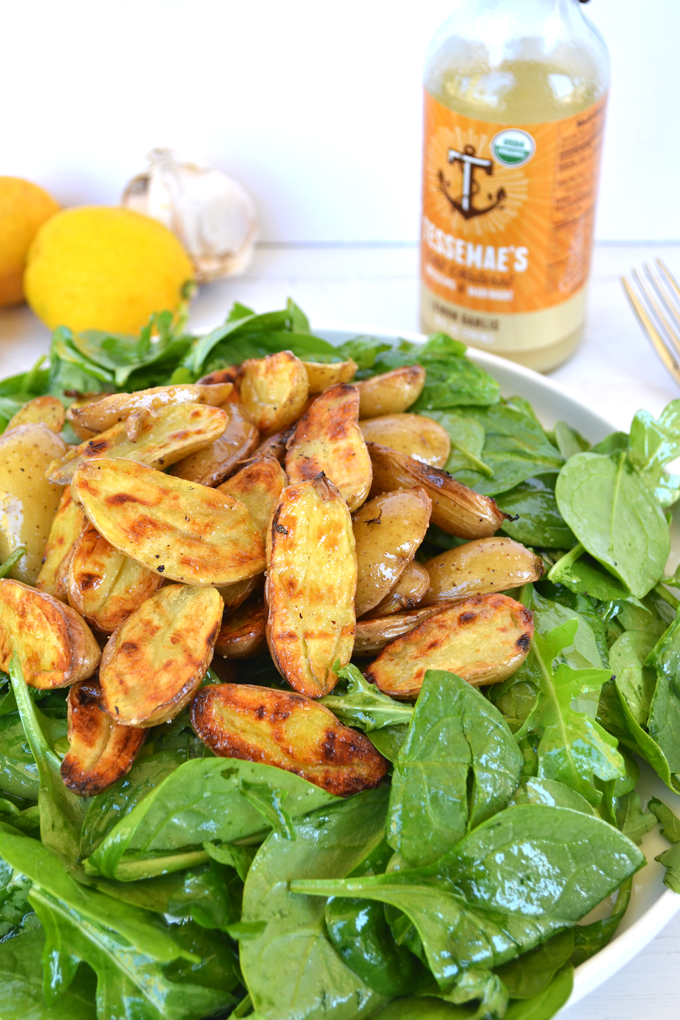 Tessamae's Lemon Garlic Vinaigrette uses all clean and Whole 30 approved ingredients and goes perfectly on this Grilled Potato Salad! It is a perfect light side dish for any spring or summer barbecue!