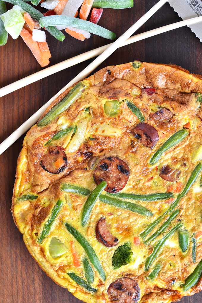 This Asian Stir-Fry Frittata is a great way to mix up your eggs in the morning!! A whole 30 approved and paleo breakfast that you will crave! Easy to make with frozen veggies!