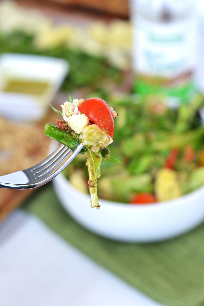 This Asparagus & Quinoa Salad with Pesto Vinaigrette is a simple and perfect salad full of flavor and nutrients! Using Rice Vinegar gives the dressing a perfectly subtle punch!