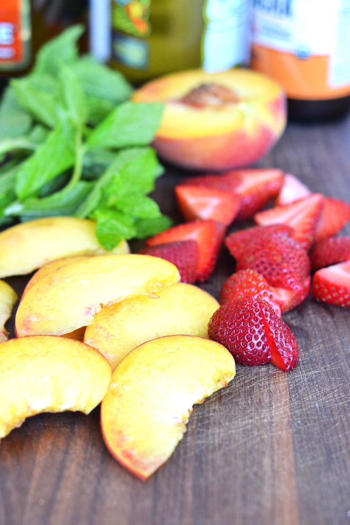 For the perfect mix of health and fun - this Ginger Peach Kombucha Sangria is a great summer drink! 3 simple ingredients and fresh fruits combine in a tasty way!