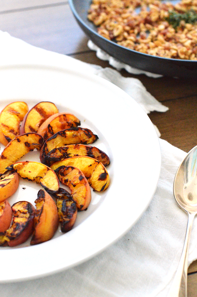 Grilled Peaches with Hazelnut Pancetta Crumble! A perfect summer dessert or appetizer for a dinner party or celebration! A paleo and whole30 option for everyone to enjoy!
