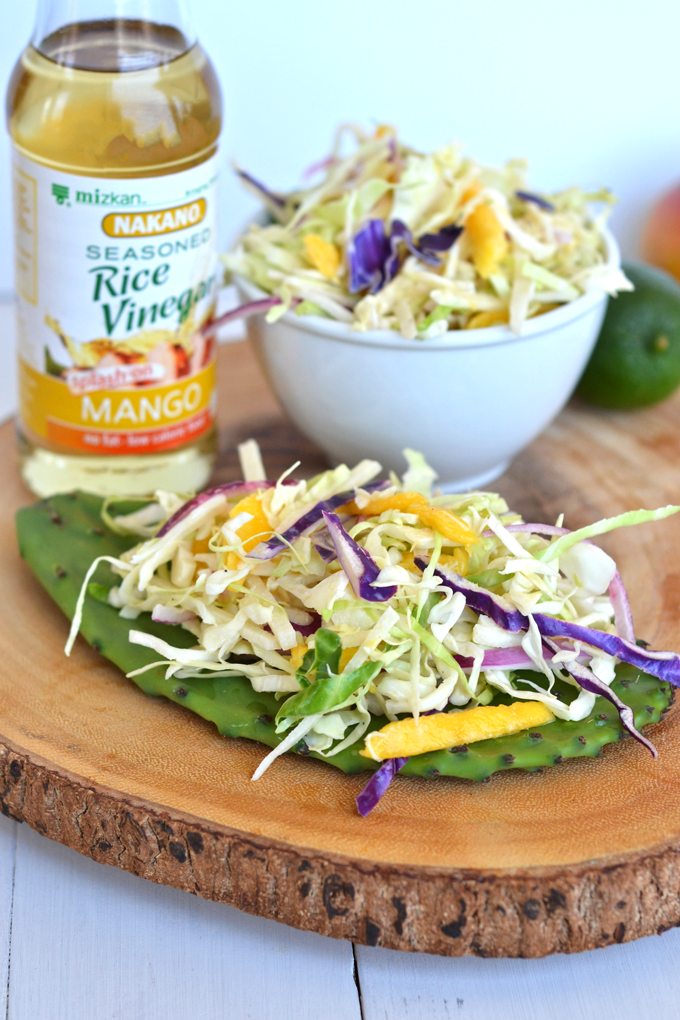 This Mango Jicama Coleslaw is a perfect side dish or topping for a pulled pork sandwich! Nakano Mango Rice Vinegar adds tons of Mango flavor!