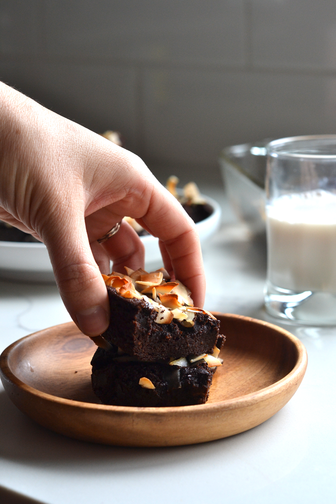 These Coconut Crusted Cacao Brownies are grain free and oil free! The healthy fat comes from avocado and they are sweetened with maple syrup!