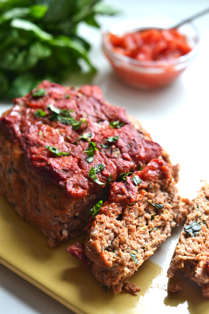 This Tomato Basil Turkey Meatloaf recipe is a perfect whole30 & paleo option that is super easy to throw together for a weeknight dinner!