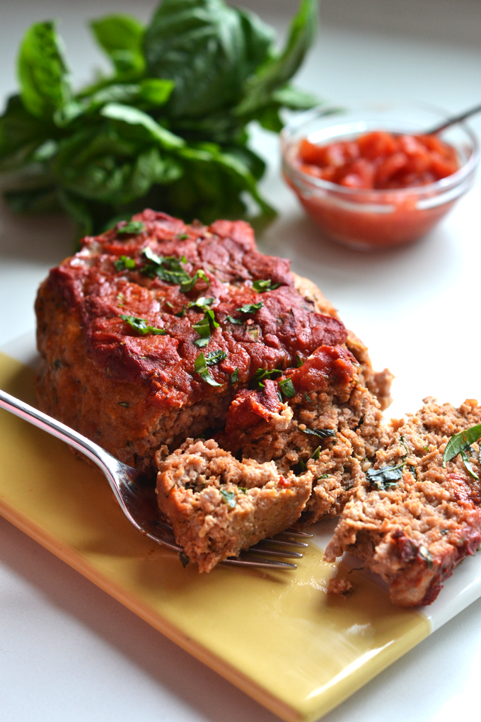 This Tomato Basil Turkey Meatloaf recipe is a perfect whole30 & paleo option that is super easy to throw together for a weeknight dinner!