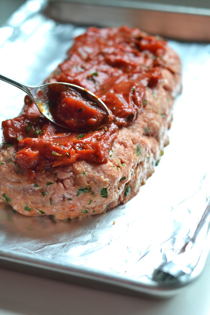 This Tomato Basil Turkey Meatloaf recipe is a perfect whole30 & paleo option that is super easy to throw together for a weeknight dinner!