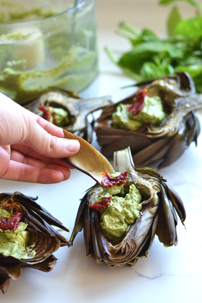 This Avocado Pesto Roasted Artichokes recipe is the perfect, healthy and beautiful appetizer for any occasion! It is whole30, paleo and dairy free!