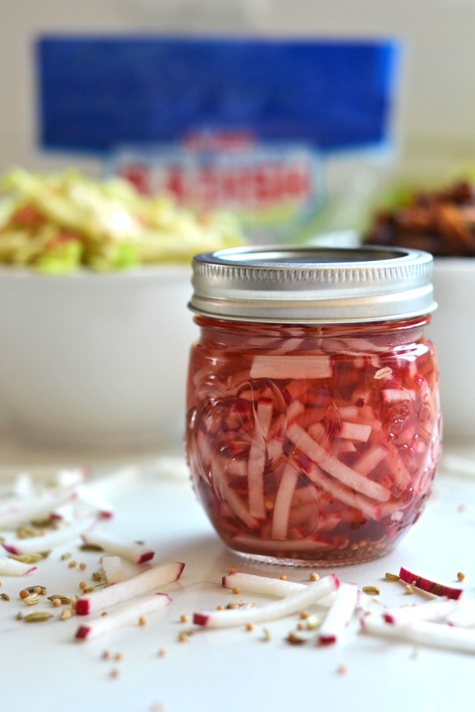 This Pulled Pork with Pickled Radish Coleslaw is a fun meal for spring and summer to preserve and use up those radishes! The pulled pork is full of flavor and comes together in a dutch oven!