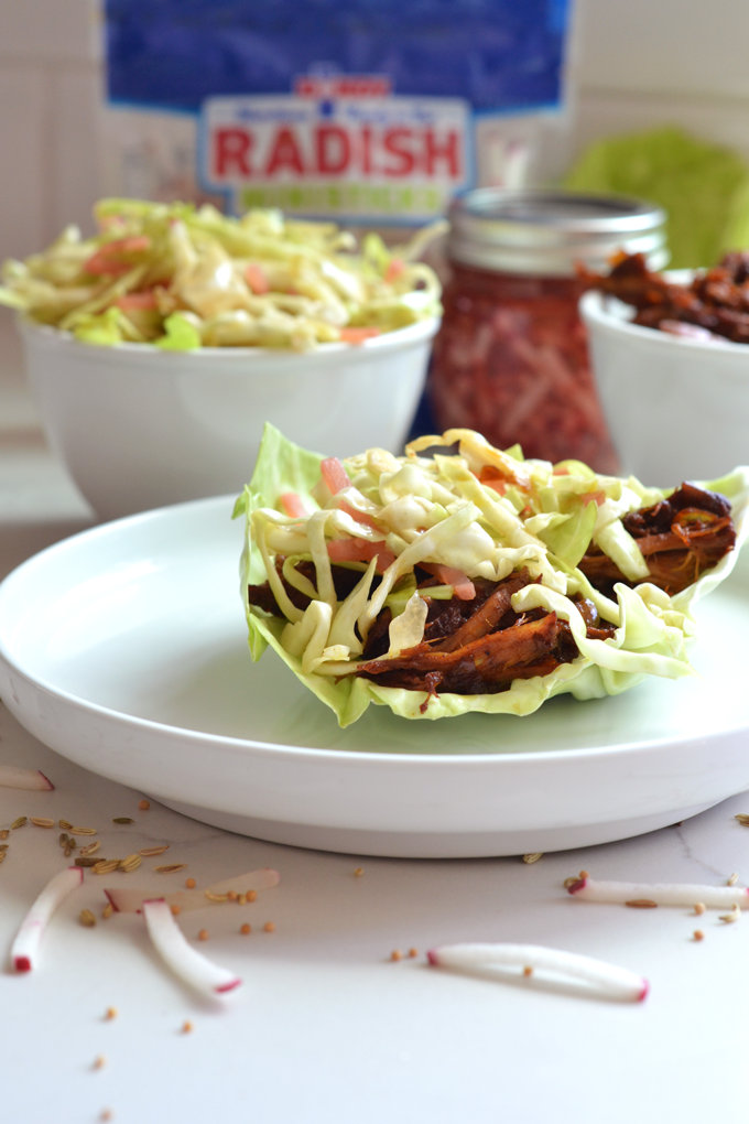 This Pulled Pork with Pickled Radish Coleslaw is a fun meal for spring and summer to preserve and use up those radishes! The pulled pork is full of flavor and comes together in a dutch oven!