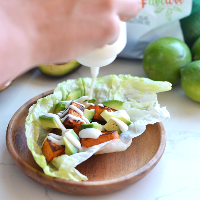 These Charred Cumin Sweet Potato & Avocado Tacos with Lime Crema are paleo, whole30, vegan, dairy free and PERFECT for cinco de mayo or any warm day! Great way to eat your favorite fruits and veggies! 