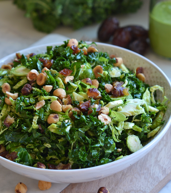 This Shaved Brussels Sprout and Kale Salad has a delicious Sweet Basil Dressing! It is a Whole30 and paleo salad for the summer!