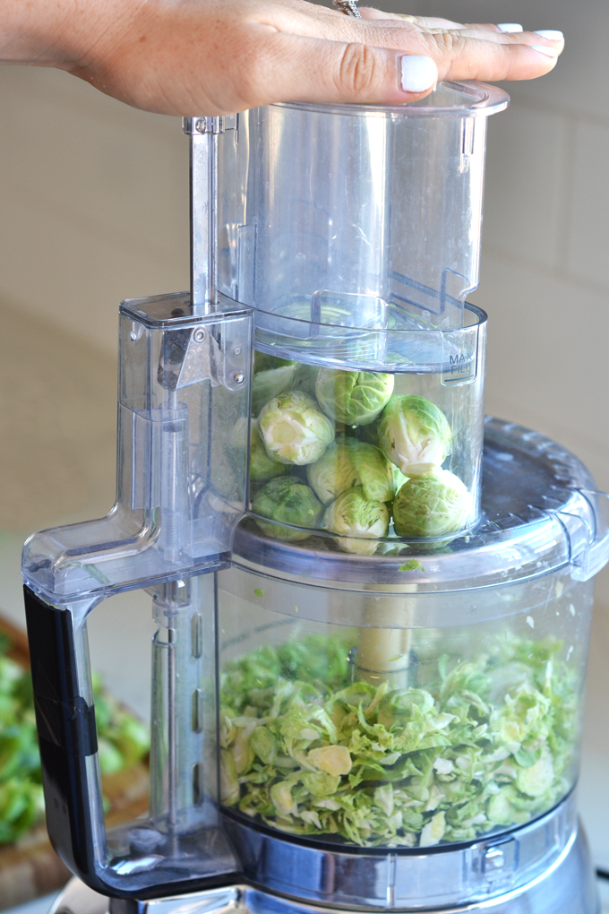 This Shaved Brussels Sprout and Kale Salad has a delicious Sweet Basil Dressing! It is a Whole30 and paleo salad for the summer!