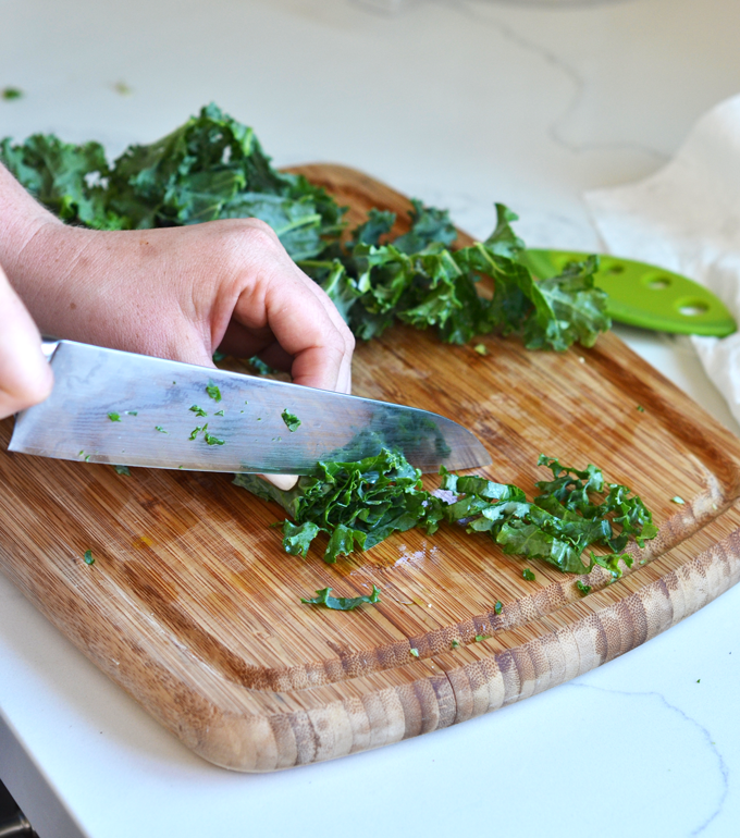 This Shaved Brussels Sprout and Kale Salad has a delicious Sweet Basil Dressing! It is a Whole30 and paleo salad for the summer!