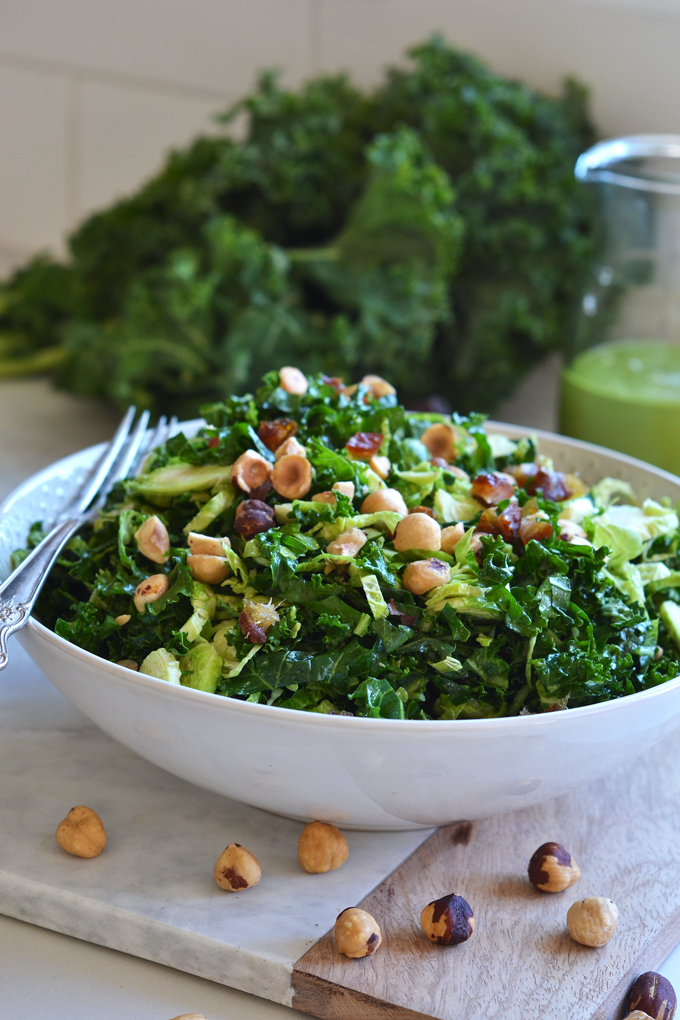 This Shaved Brussels Sprout and Kale Salad has a delicious Sweet Basil Dressing! It is a Whole30 and paleo salad for the summer!
