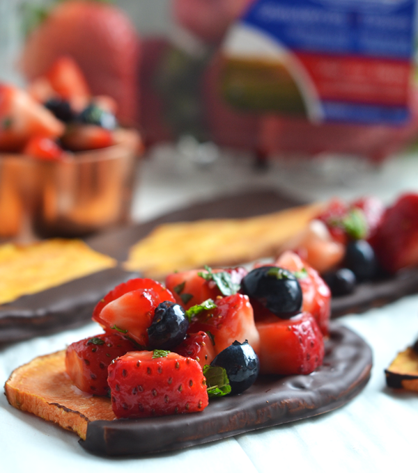 This Chocolate Dipped Sweet Potato Toast with Strawberry Salsa is the perfect way to enjoy sweet potatoes for dessert!! The simple strawberry salsa is made with California Giant Berry Farms strawberries and blueberries and tossed with honey and mint!