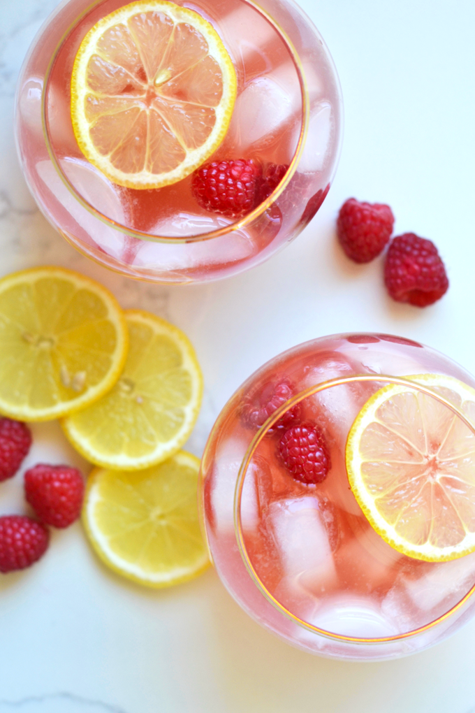 This Raspberry Lemon Kombucha Sangria is the perfect fresh way to celebrate the summer! Packed with flavor and probiotics!