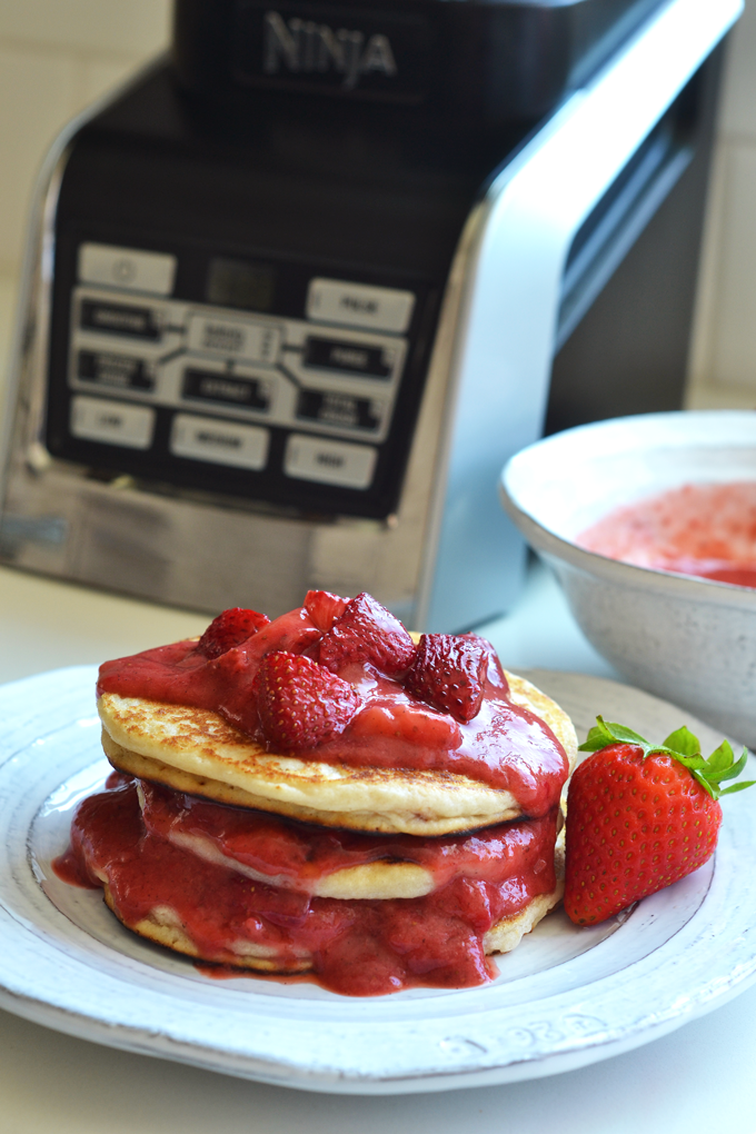 This Roasted Strawberry Vanilla Bean Sauce goes perfectly with these paleo and vegan pancakes and both recipes come together in a ninja blender!