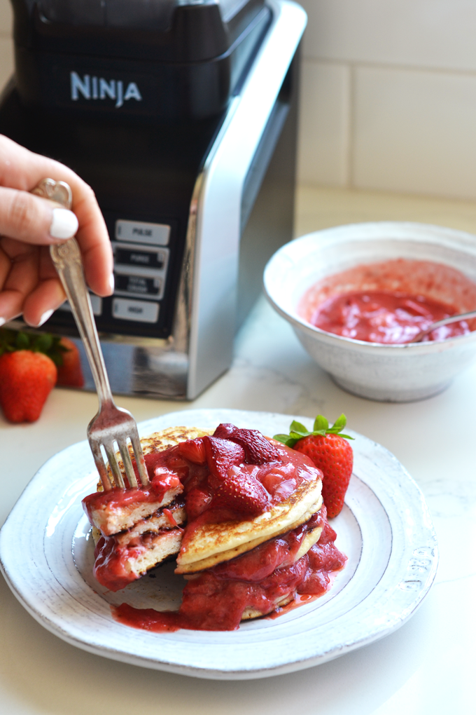 This Roasted Strawberry Vanilla Bean Sauce goes perfectly with these paleo and vegan pancakes and both recipes come together in a ninja blender!