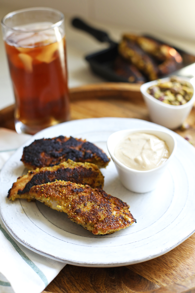 These Garlic Pistachio Chicken Tenders with Rosemary Tahini Dipping Sauce are Whole30 and paleo - perfect for an easy dinner!