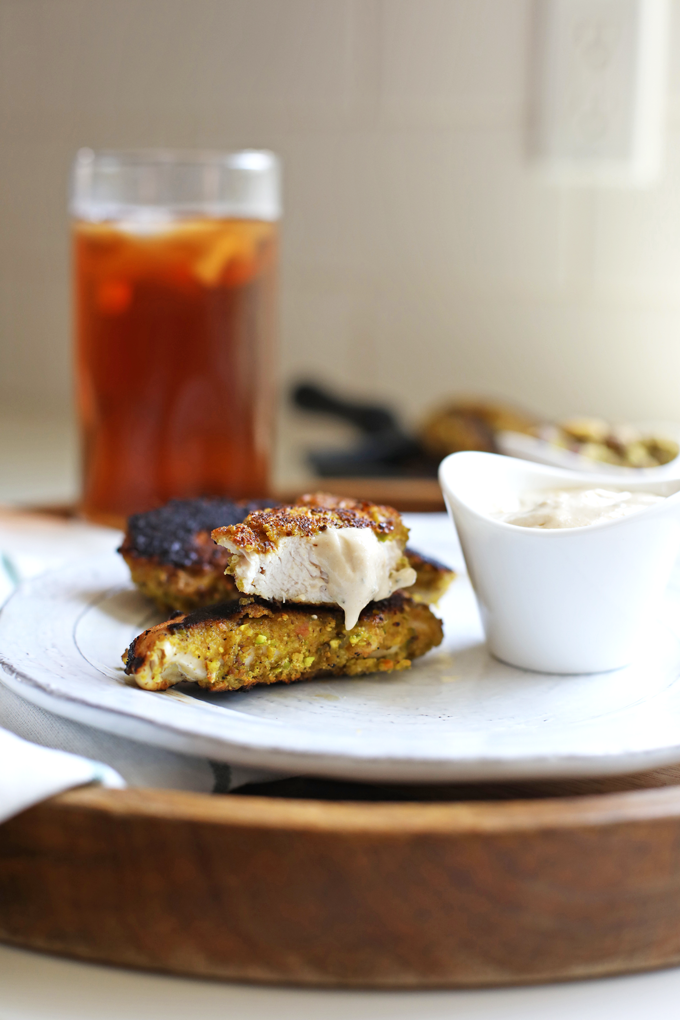 These Garlic Pistachio Chicken Tenders with Rosemary Tahini Dipping Sauce are Whole30 and perfect for kids too!