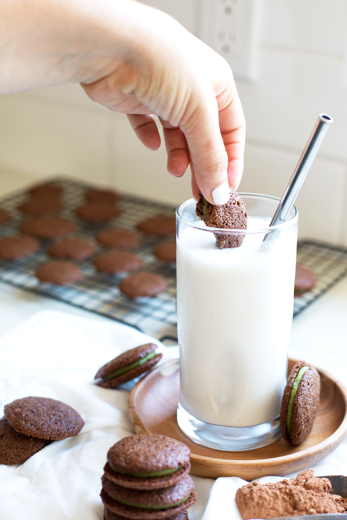 These Grain Free Chocolate Mint Sandwich Cookies are the perfect treat that everyone from kids to adults will enjoy! The filling is sweetened with maple syrup and creamy from cashews!