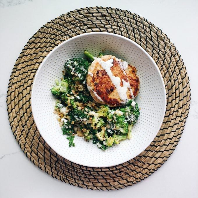 Whole30 approved lunch - sauteed broccoli, kale and cauliflower rice with a Tribali chicken patty on top!