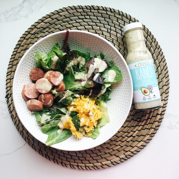 Whole30 Approved Lunch - Salad with leftovers and chicken apple sausage topped with Primal Kitchen Ranch dressing!