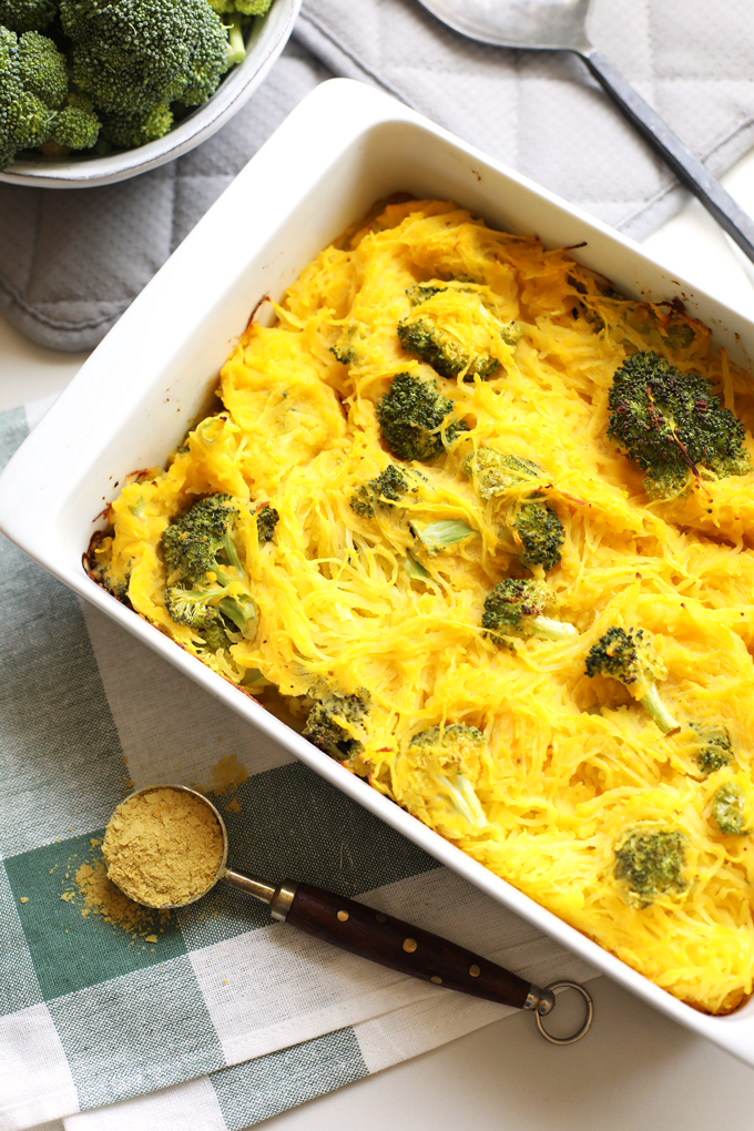 This Broccoli "Cheese" Spaghetti Squash Bake is a great way to celebrate fall comfort food with none of the guilt! With a cheese sauce made from butternut squash this is Paleo and Whole30!