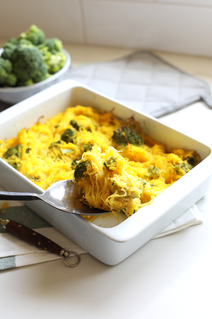 This Broccoli "Cheese" Spaghetti Squash Bake is a great way to celebrate fall comfort food with none of the guilt! With a cheese sauce made from butternut squash this is Paleo and Whole30!