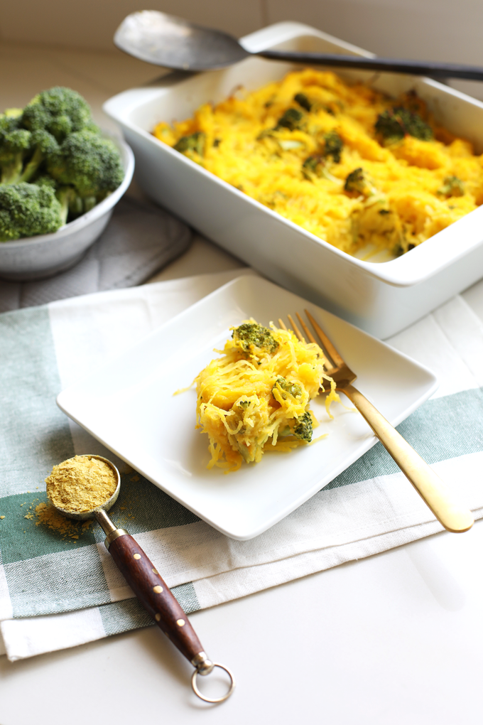 This Broccoli "Cheese" Spaghetti Squash Bake is a great way to celebrate fall comfort food with none of the guilt! With a cheese sauce made from butternut squash this is Paleo and Whole30!