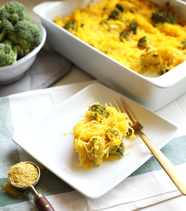 This Broccoli "Cheese" Spaghetti Squash Bake is a great way to celebrate fall comfort food with none of the guilt! With a cheese sauce made from butternut squash this is Paleo and Whole30!