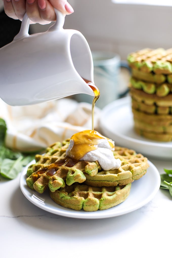 These Spinach Almond Flour Waffles are a simple paleo breakfast that the whole family will love! Perfect for sneaking in extra veggies in a delicious way!
