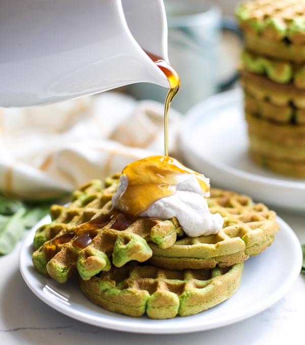 These Spinach Almond Flour Waffles are a simple paleo breakfast that the whole family will love! Perfect for sneaking in extra veggies in a delicious way!