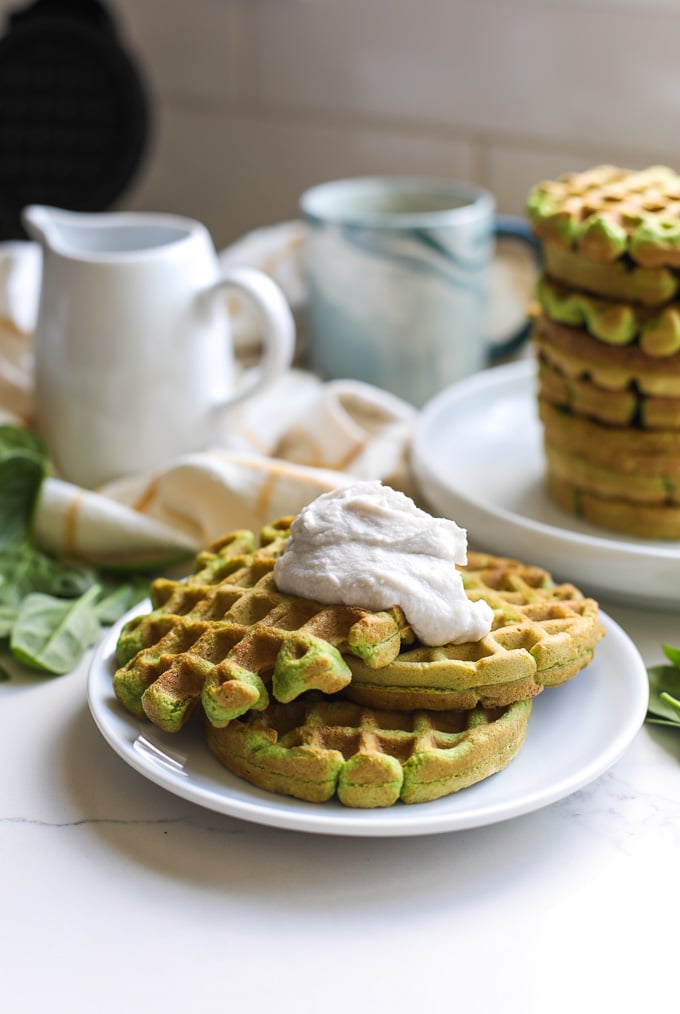 These Spinach Almond Flour Waffles are a simple paleo breakfast that the whole family will love! Perfect for sneaking in extra veggies in a delicious way!