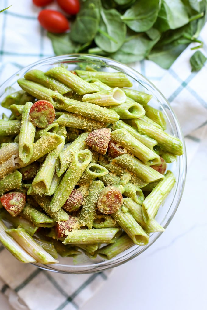 This Spinach Pesto Pasta Salad is the perfect side dish for spring and summer! Can be served hot or cold and is great for make ahead!