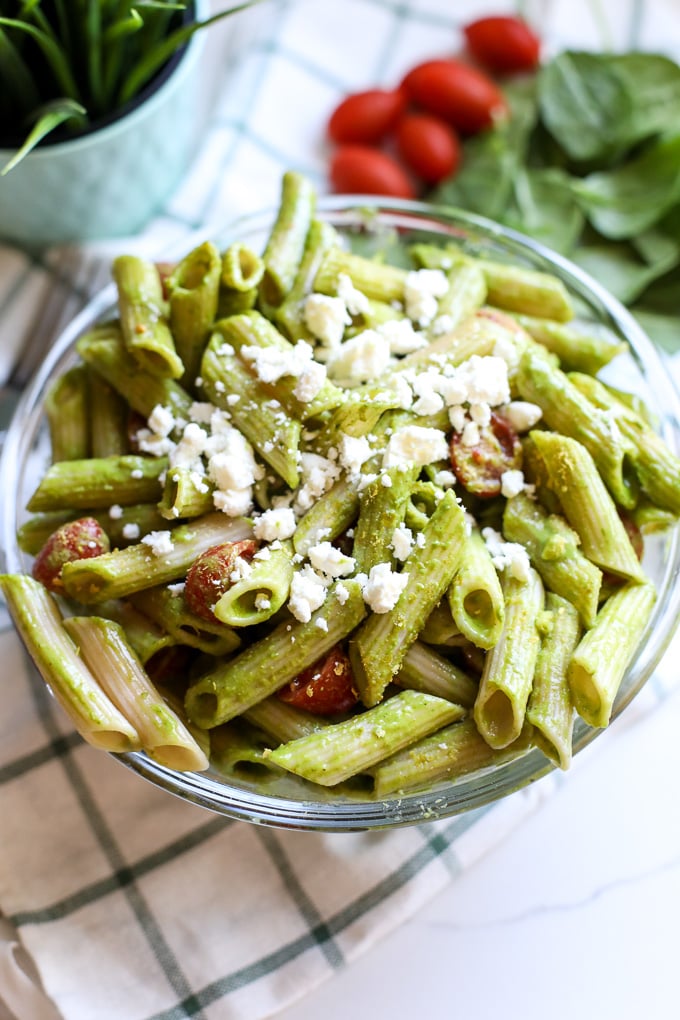 This Spinach Pesto Pasta Salad is the perfect side dish for spring and summer! Can be served hot or cold and is great for make ahead!